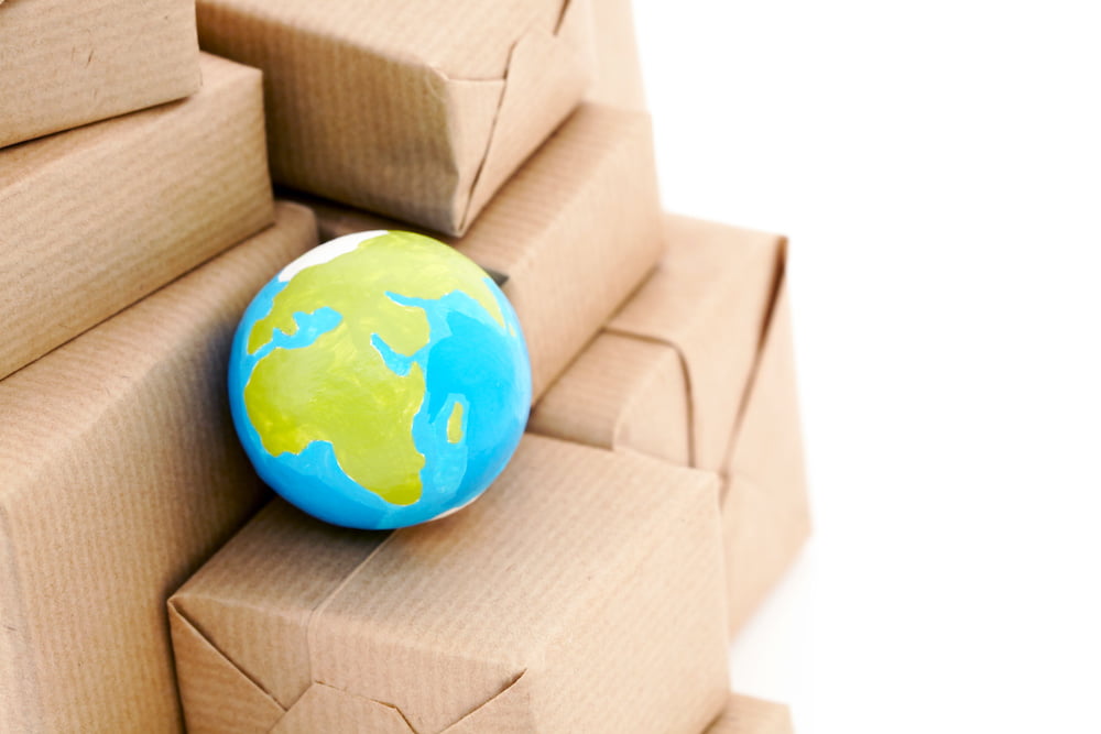 Globe nestled among cardboard boxes