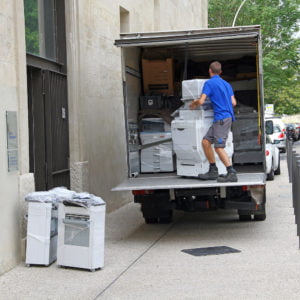 Man moving copy machines