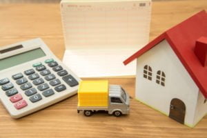House with truck and calculator