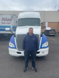 keith truck driver in front of truck