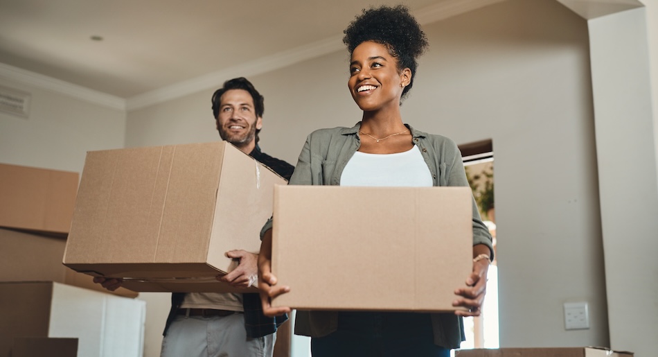 Couple packing and showing how to move across country cheaply